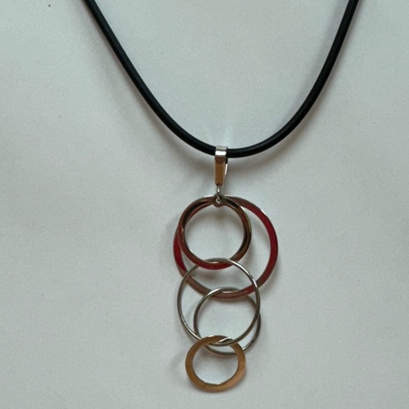 14k stamped white gold geometric pendant on a black rubber cord, gold clasp. - Picture 1 of 6